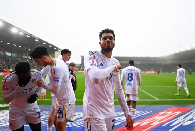 Leeds players celebrate Georgino Rutter's goal at Plymouth