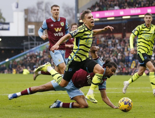 Denis Franchi concedes a penalty after fouling Arsenal's Leandro Trossard