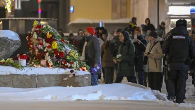 Some citizens lay flowers at the Solovetsky Stone to commemorate the Russian opposition leader Alexei Navalny after he died in a prison colony where he was serving his sentence, in Moscow, Russia on February 16, 2024