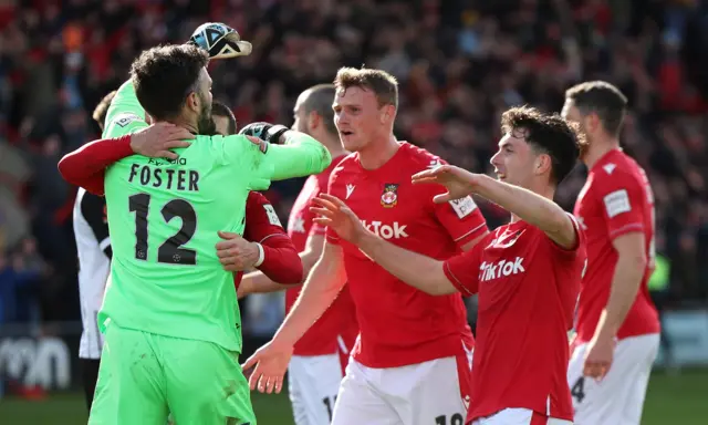 Wrexham celebrate Ben Foster's penalty save against Notts County in 2023