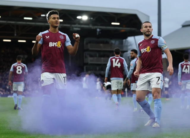 Ollie Watkins celebrates scoring their second goal with John McGinn