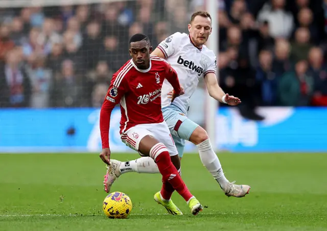 Callum Hudson-Odoi of Nottingham Forest is challenged by Vladimir Coufal