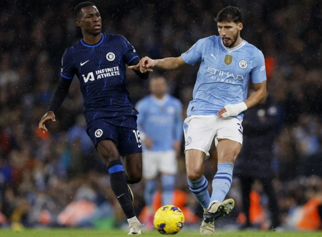 Jackson presses Dias, as he passes the ball away