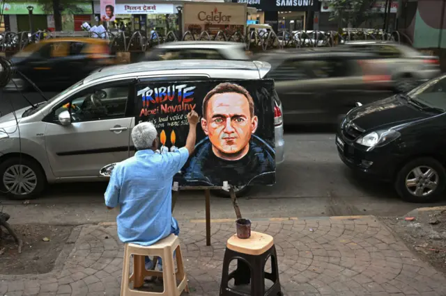 An art school teacher Prithviraj Kambli gives final touches to a painting of late Russian opposition leader and Kremlin's most prominent critic Alexei Navalny to pay tribute in Mumbai