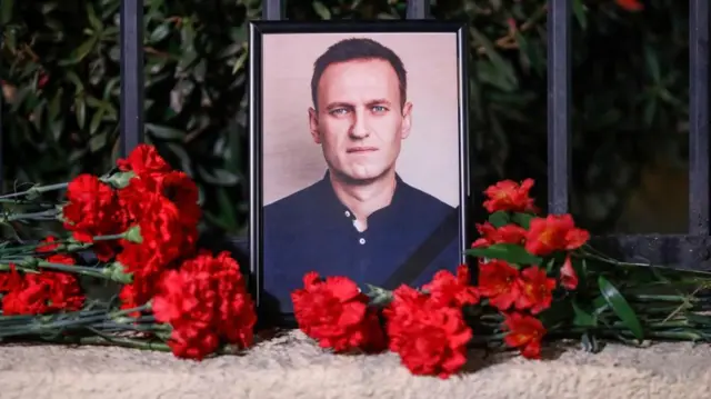 Flowers lay near a portrait of Russian late opposition leader Alexei Navalny in front of the Russian embassy, in Tbilisi, Georgia