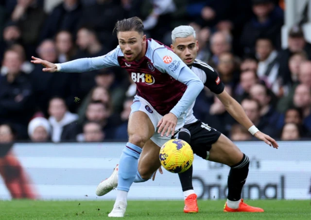 Matty Cash in action with Fulham's Andreas Pereira