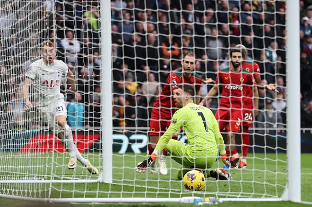 Jose Sa of Wolverhampton Wanderers fails to save a shot by Dejan Kulusevski