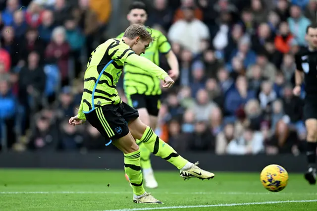 Martin Odegaard of Arsenal scores his team's first goal