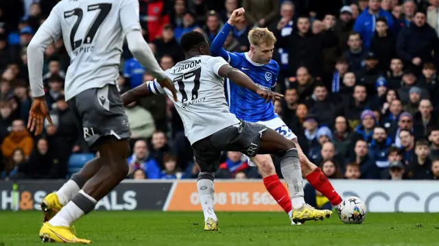 Paddy Lane, of Portsmouth, scores against Reading