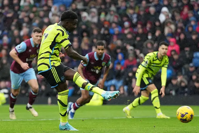 Bukayo Saka takes a penalty