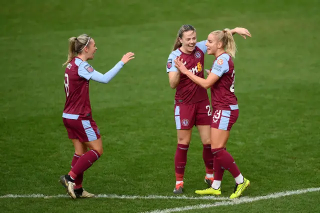 Leon is congratulated by Villa teammates after scoring v Spurs.