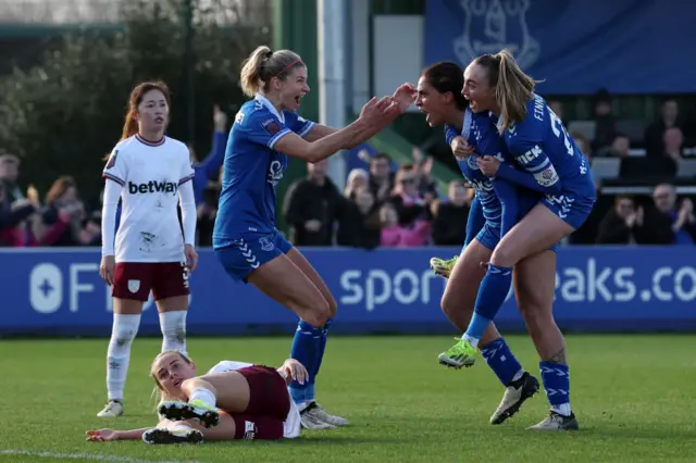 Piemonte is mobbed by teammates after scoring for Everton.