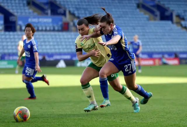 Powell and O'Brien duel for the ball on the wing.