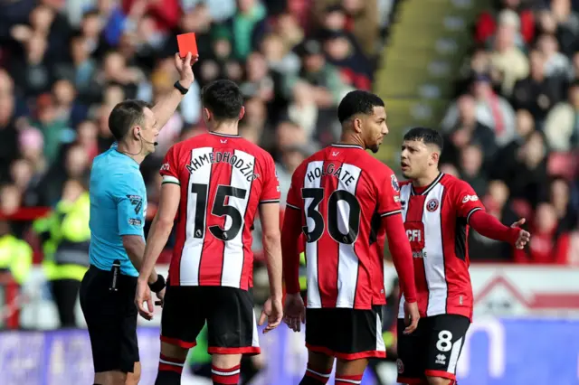 Mason Holgate getting shown a red card