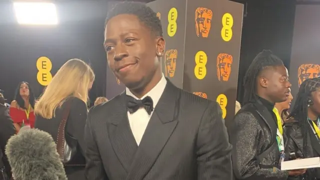 David Jonsson, star of Rye Lane, on the Bafta red carpet