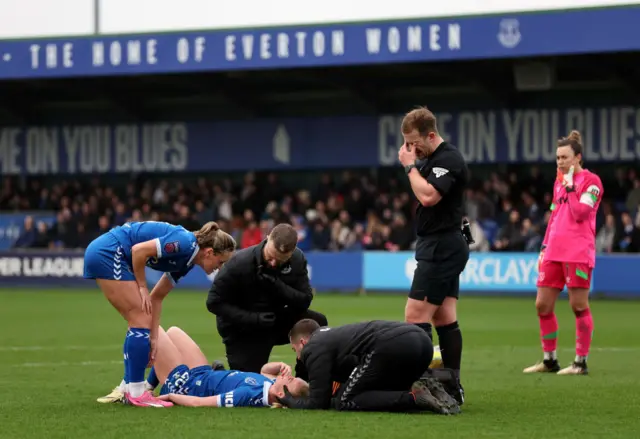 Madsen is treated by the Everton physios.