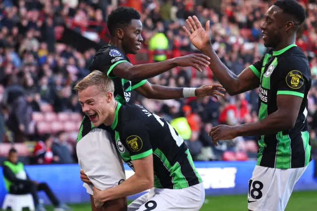 Simon Adingra celebrating after scoring for Brighton