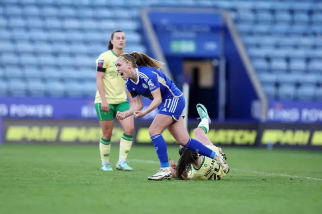 Cayman celebrates as Bristol players look defeated.