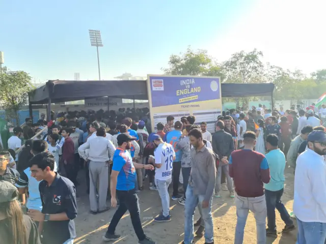 Fans gather outside the ticket office at Rajkot