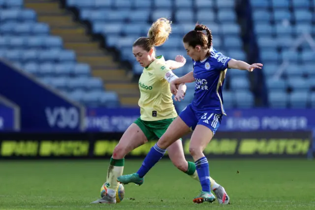 Tierney and Connolly battle for the ball.