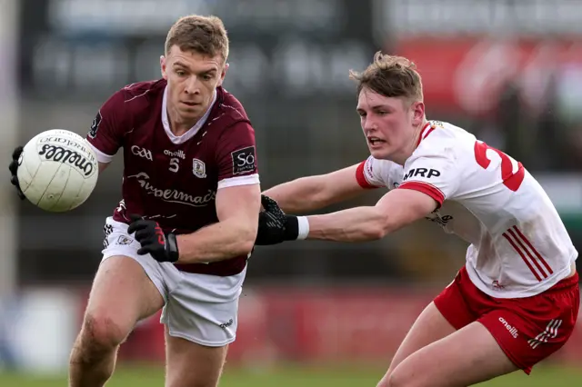 Galway's Dylan McHugh attempts to get past Tyrone's Lorcan McGarrity