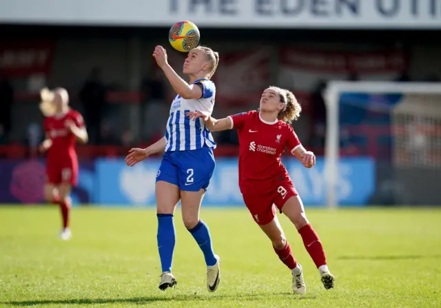 Kiernan battles Thorisdottir in midfield.