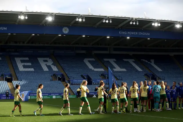 Players make their way onto the field at King Power stadium.