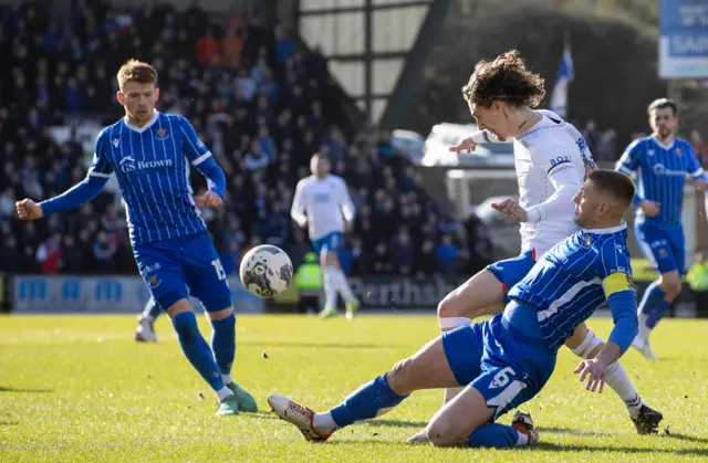 Fabio Silva is challenged by Liam Gordon