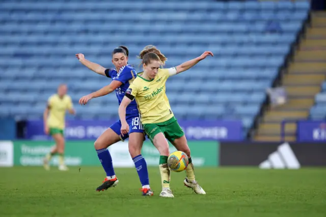 Rodgers tries to hold off a challennge from a Leicester attacker.