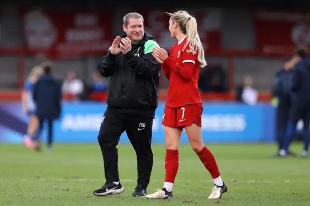 Matt Beard chats to Missy Bo Kearns on the pitch at full time.