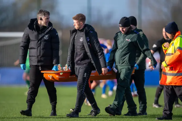 Olesen is stretchered off after suffering a serious looking injury.