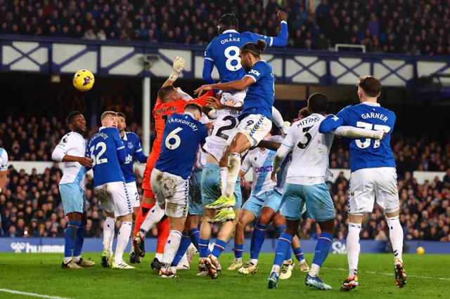 Amadou Onana jumps higher than those around him to score a header