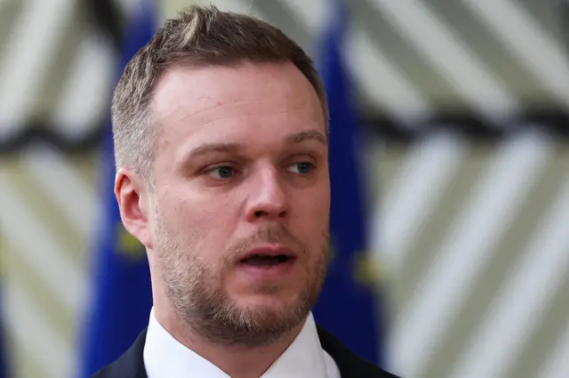 Lithuania's Foreign Minister Gabrielius Landsbergis talks to the press in Brussels, 19 February 2024