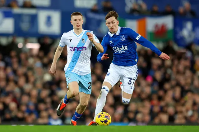 Adam Wharton of Crystal Palace and James Garner of Everton battle for possession