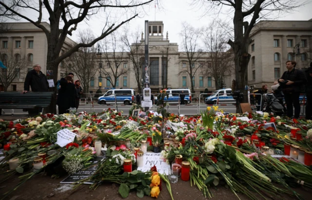 Flowers are spread on the ground during a rally in reaction to the death of Alexei Navalny in front of the Russian embassy in Berlin