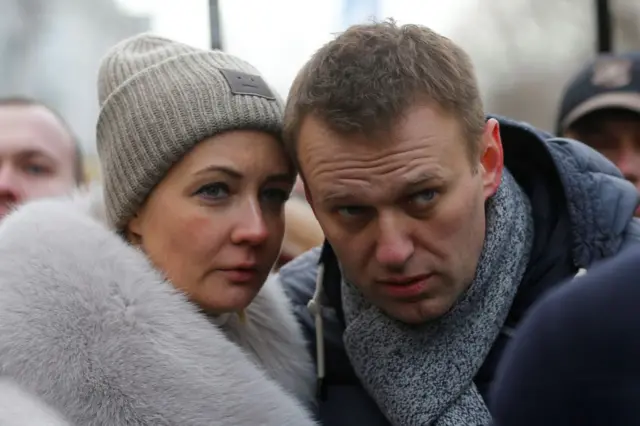 Russian opposition leader Alexei Navalny and his wife Yulia take part in a march in memory of opposition leader Boris Nemtsov in Moscow, Russia, on February 26, 2017.