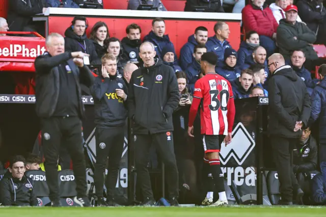 Chris Wilder watches on as Mason Holgate trudges off the pitch after his red card against Brighton