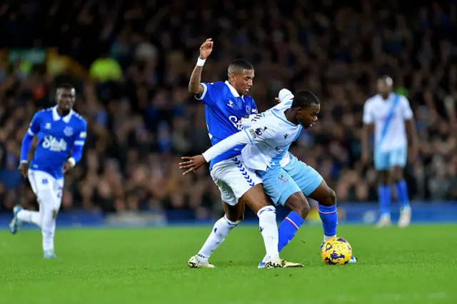 Ashley Young battles for the ball