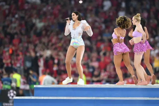 Dua Lipa singing at the 2018 Champions League final between Liverpool and Real Madrid