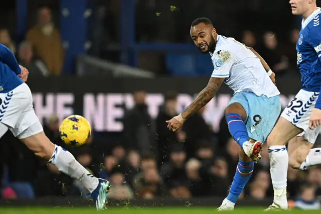 Jordan Ayew (C) shoots to score the opening goal