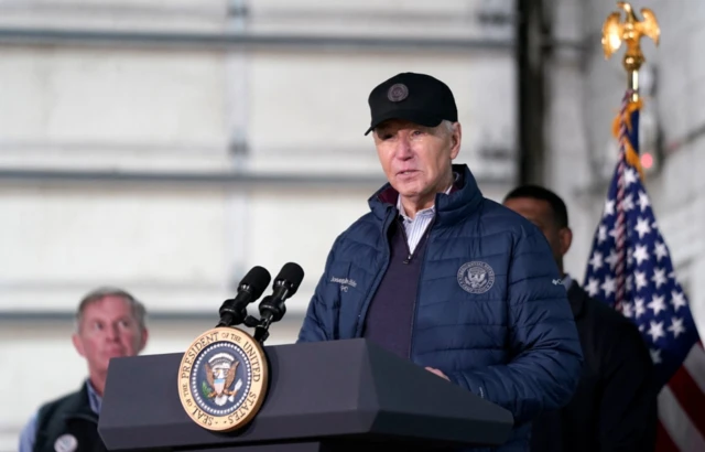 US President Joe Biden delivers speaks at a podium