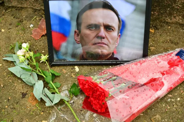 Flowers are seen laid in homage to Alexei Navalny, next to the Russian Embassy in Paris, France.