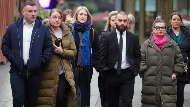 Esther Ghey is pictured with a group of people outside court