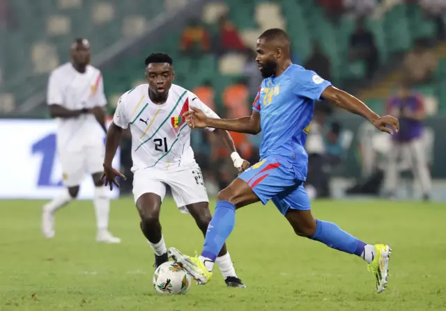 Guinea's Sekou Sylla in action with DR Congo's Gedeon Kalulu