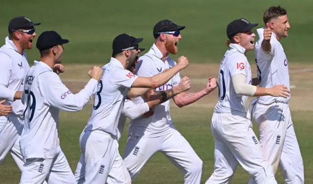England cricketers celebrating their Test win over India