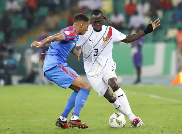 Charles Pickel in action with Guinea's Issiaga Sylla
