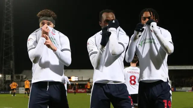 Bolton players celebrate at Cambridge