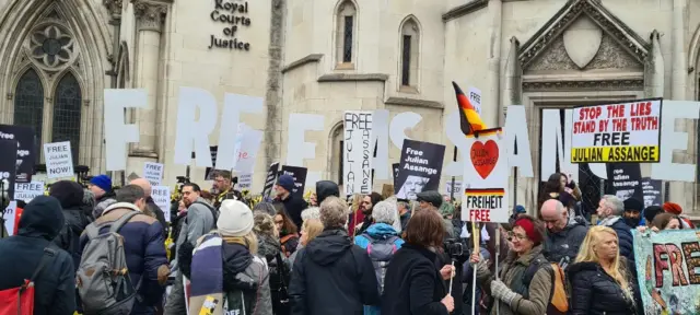 Crowds gather with placards outside High Court for Assange hearing