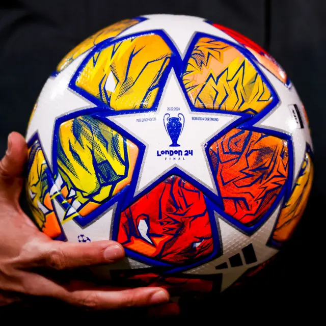 The UCL match ball is held by a ref before kick off.