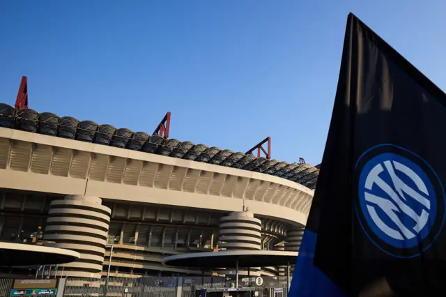 An Inter flag is flown outside San Siro.